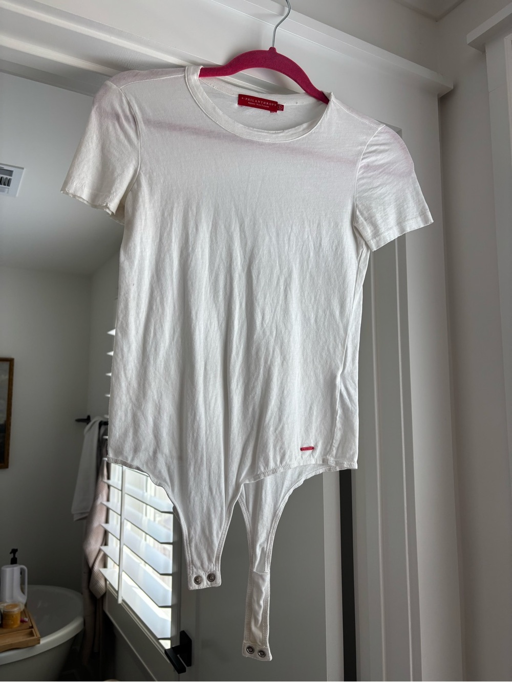 Women’s White Short-Sleeve Bodysuit with Snap Hem